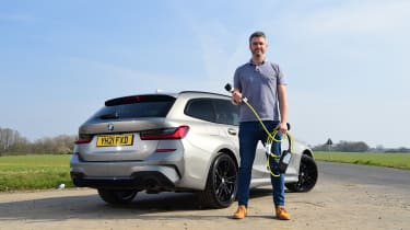 BMW 300e Touring long term test - Richard Ingram with charging cable